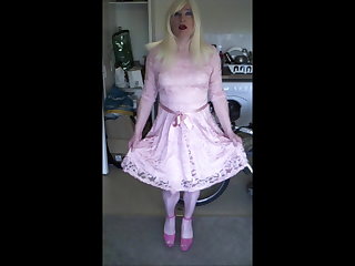 Sandra practising curtsey in her pink dress